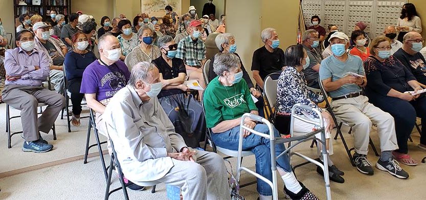 Senior citizens attend a program.