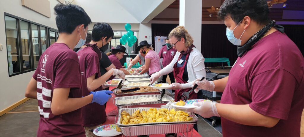 Volunteers giving residents healthy food